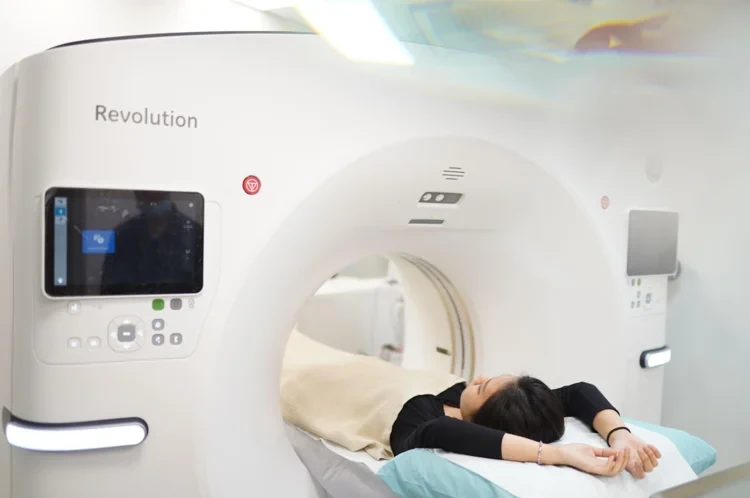 Patient lying on the table of a CT scanner during a scan