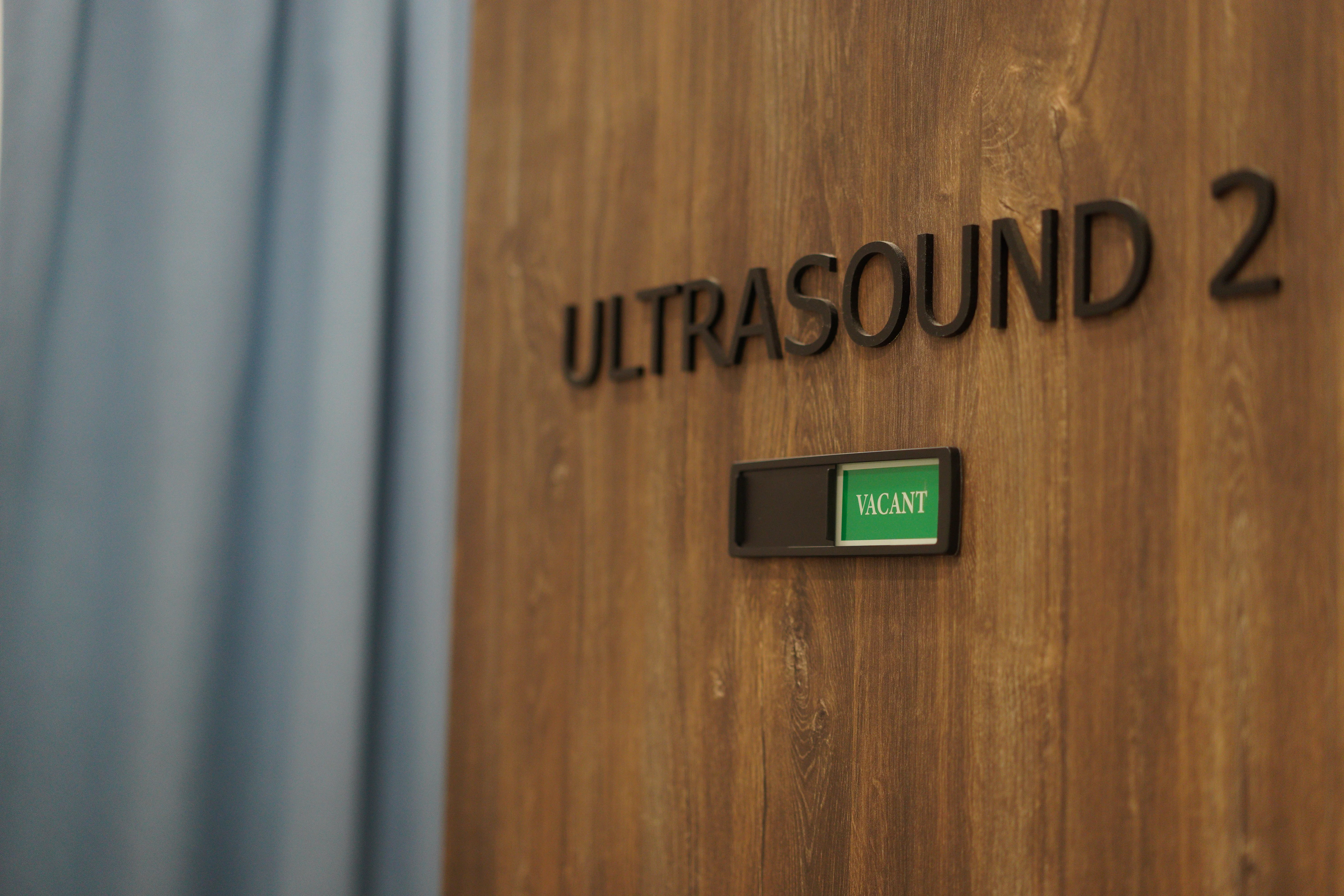 Ultrasound scan room door with vacant sign at Singapore Women's Clinic