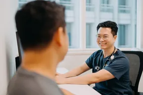 Dr Leonard Leng consulting a patient at Singapore Women's Clinic