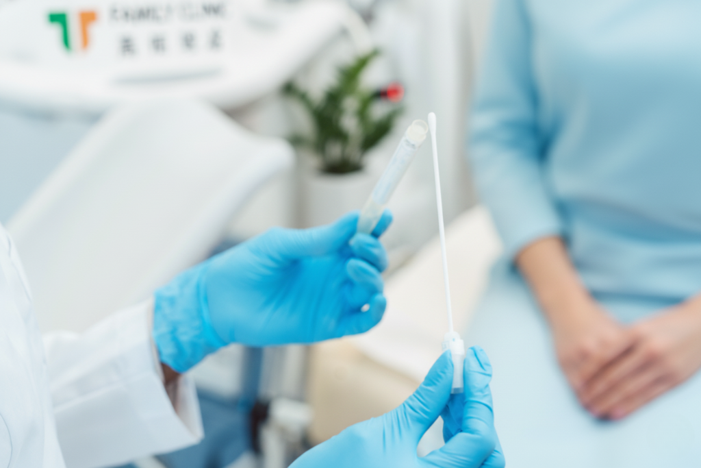 Doctor preparing vaginal swab sample for candidiasis testing and diagnosis