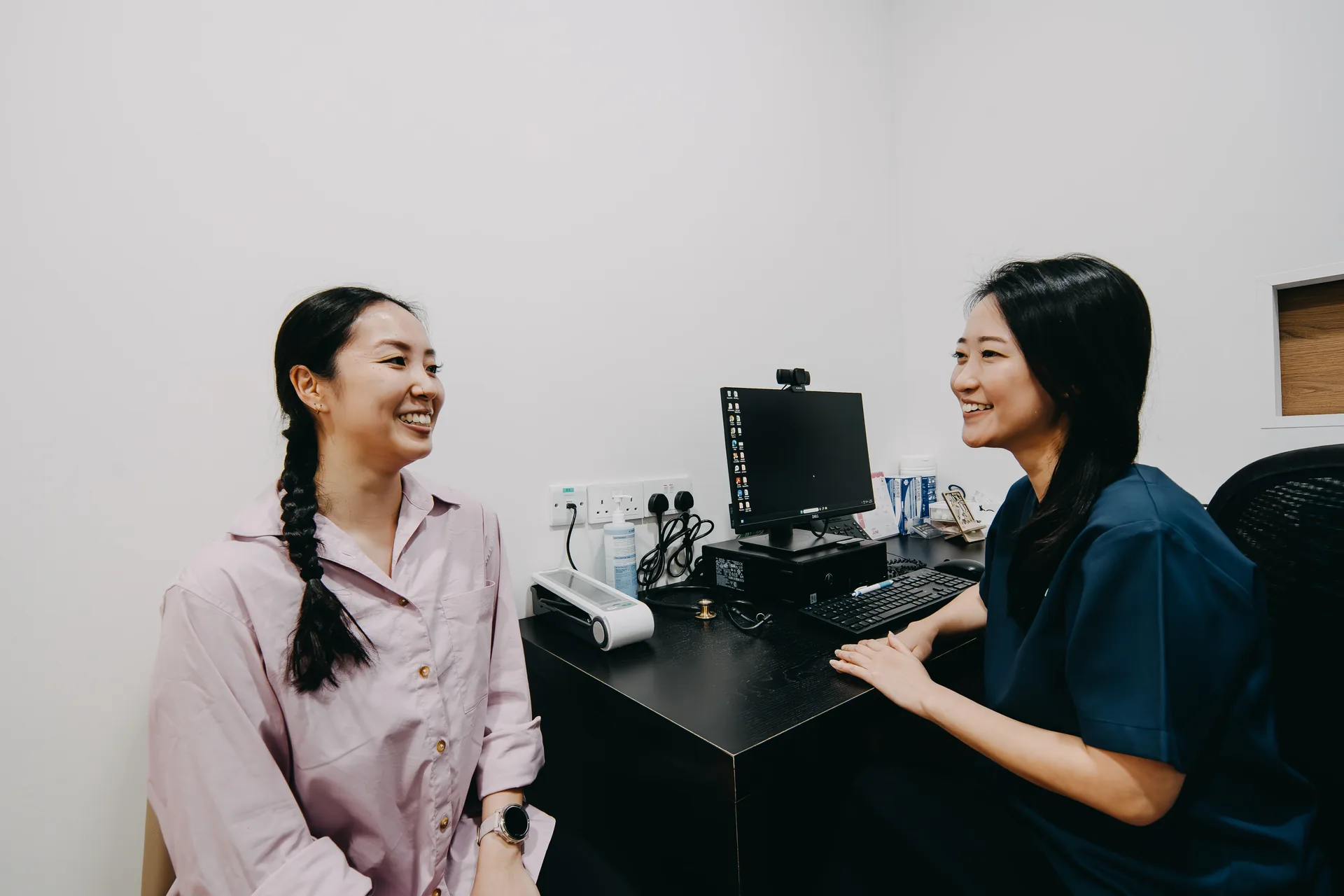 Dr Jana Lim consulting a patient